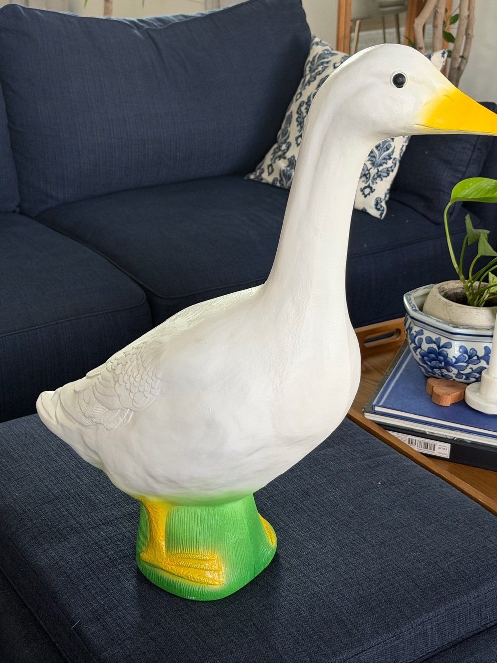 Large White Decorative Goose Statue with Yellow Beak and Green Base